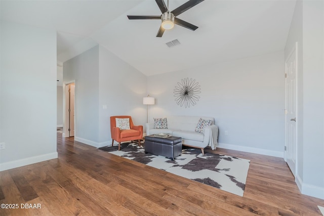 sitting room with hardwood / wood-style floors, lofted ceiling, and ceiling fan