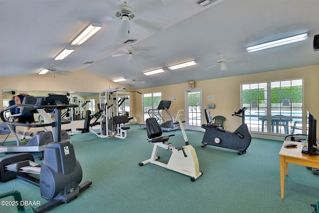 exercise room featuring ceiling fan, a wealth of natural light, and lofted ceiling