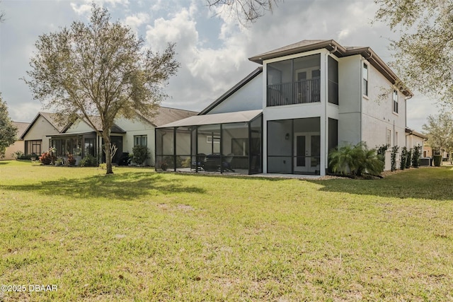 rear view of house with a lawn