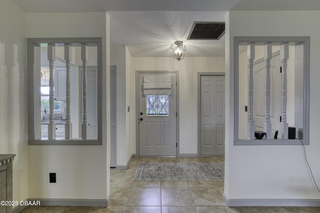 1408 Mollie Rd, Daytona Beach, FL 32114 - entryway with plenty of natural light, light tile patterned flooring, and a textured ceiling