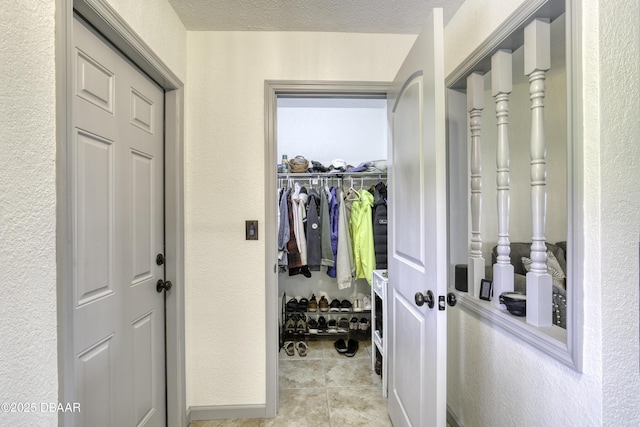 1408 Mollie Rd, Daytona Beach, FL 32114 - walk in closet featuring light tile patterned floors