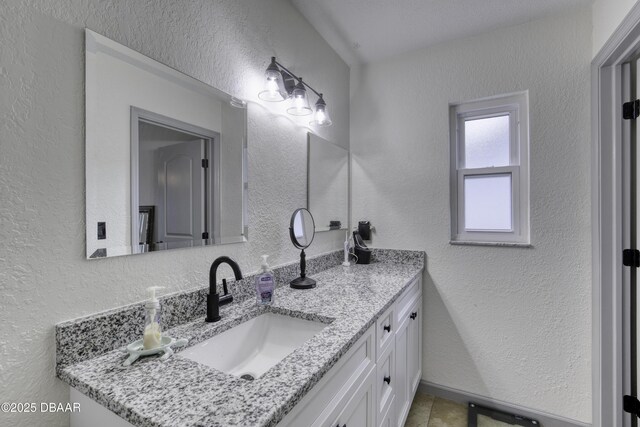 1408 Mollie Rd, Daytona Beach, FL 32114 - bathroom featuring vanity and a textured wall