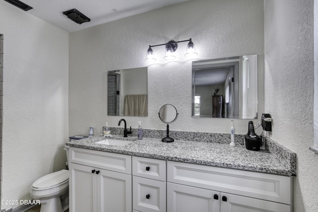 1408 Mollie Rd, Daytona Beach, FL 32114 - bathroom with a textured wall and vanity