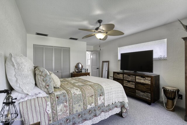 1408 Mollie Rd, Daytona Beach, FL 32114 - bedroom with a closet, a textured wall, a textured ceiling, carpet flooring, and a ceiling fan