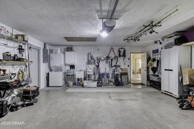 1408 Mollie Rd, Daytona Beach, FL 32114 - garage featuring stacked washer / dryer and electric panel