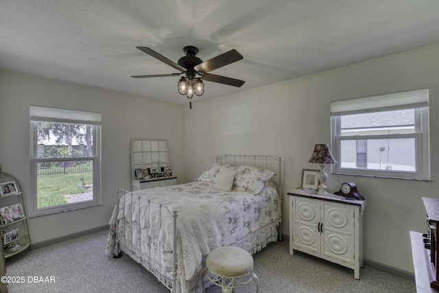 1408 Mollie Rd, Daytona Beach, FL 32114 - bedroom with light colored carpet, multiple windows, and ceiling fan