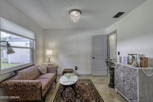 1408 Mollie Rd, Daytona Beach, FL 32114 - sitting room with a chandelier and light tile patterned flooring
