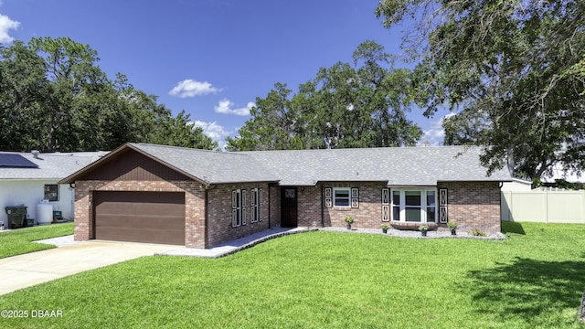 1408 Mollie Rd, Daytona Beach, FL 32114 - single story home with an attached garage, brick siding, a shingled roof, and concrete driveway