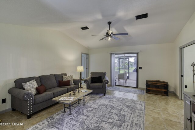 1408 Mollie Rd, Daytona Beach, FL 32114 - living area with lofted ceiling, light tile patterned floors, and a ceiling fan