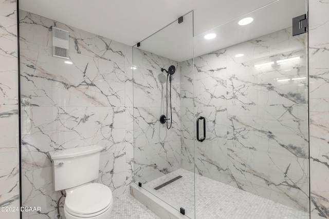 full bath with stone wall, a marble finish shower, and toilet