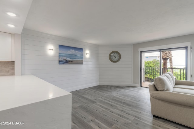 living room featuring light wood-style flooring and baseboards