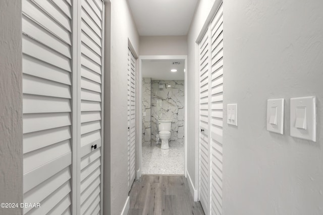 hallway with wood finished floors