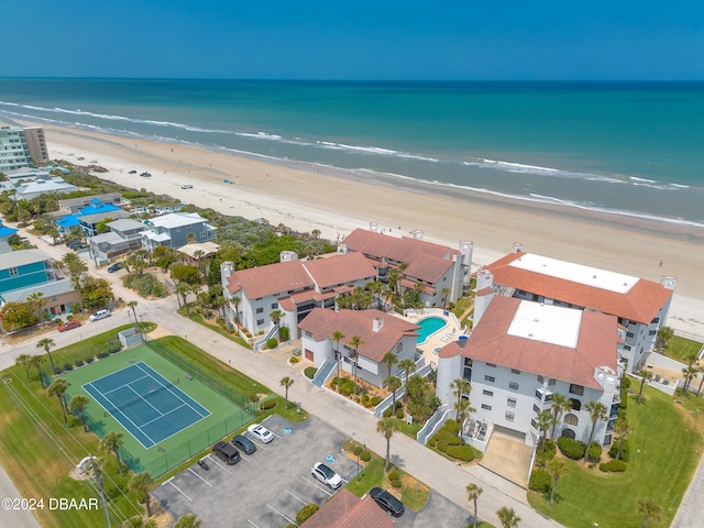 bird's eye view featuring a view of the beach and a water view