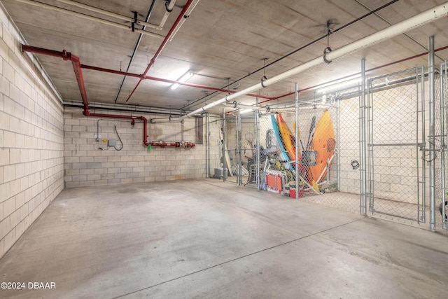 garage with concrete block wall