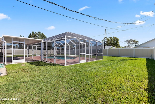 view of yard with a lanai, a patio area, and a fenced in pool