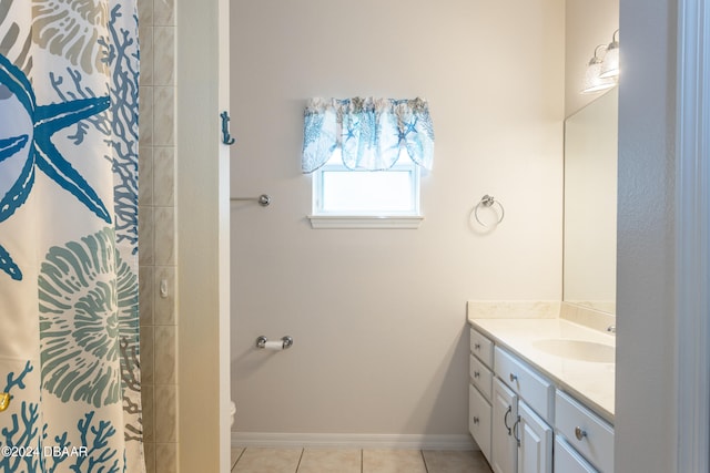 bathroom featuring tile patterned flooring, vanity, and a shower with shower curtain