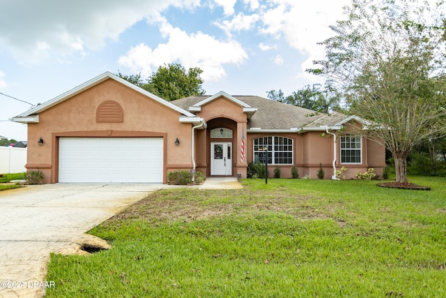 ranch-style home featuring a garage and a front lawn