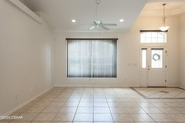 tiled entryway featuring ceiling fan