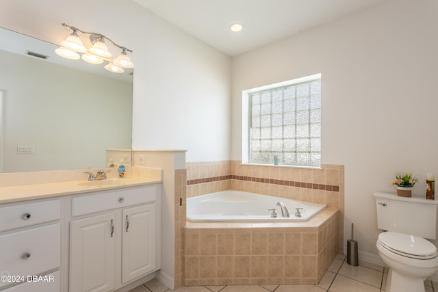 bathroom featuring tile patterned floors, vanity, a relaxing tiled tub, and toilet