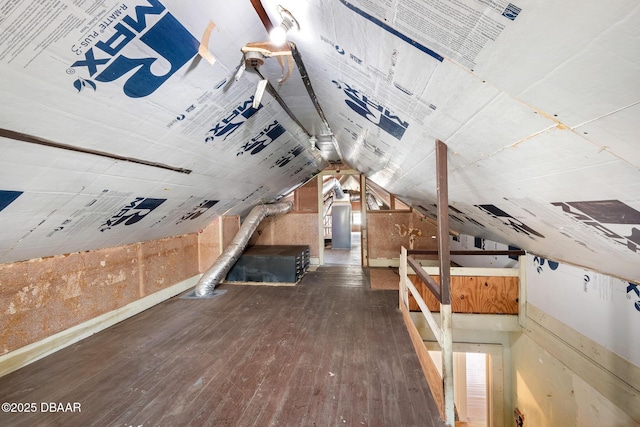 bonus room with dark hardwood / wood-style floors and vaulted ceiling