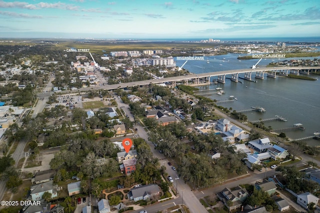 birds eye view of property with a water view