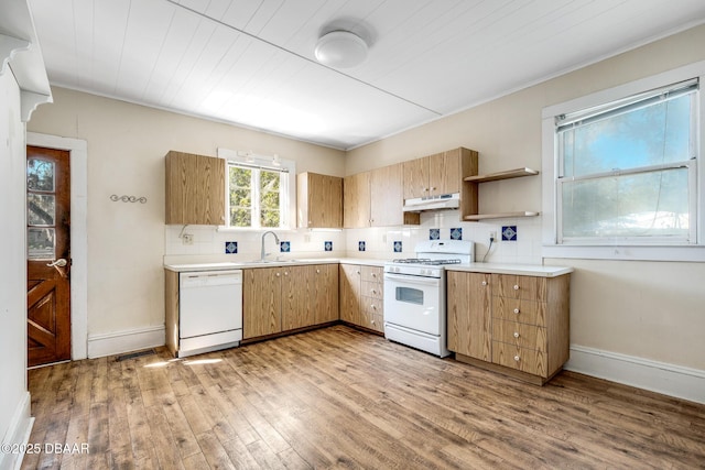 kitchen with sink, white appliances, light hardwood / wood-style flooring, decorative backsplash, and wooden ceiling