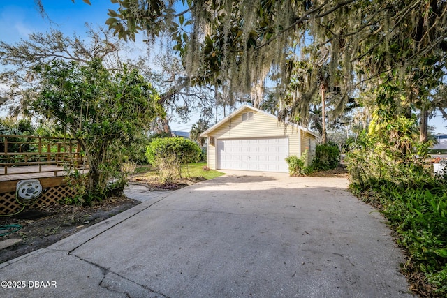 view of front of property with a garage and an outbuilding