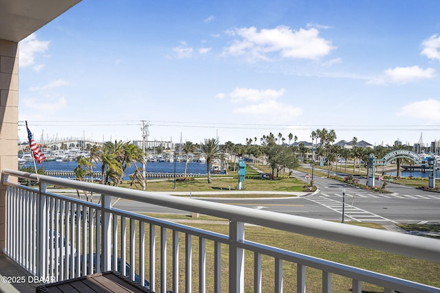 balcony featuring a water view