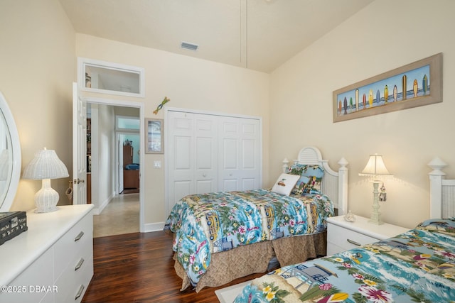 bedroom featuring dark hardwood / wood-style flooring and a closet