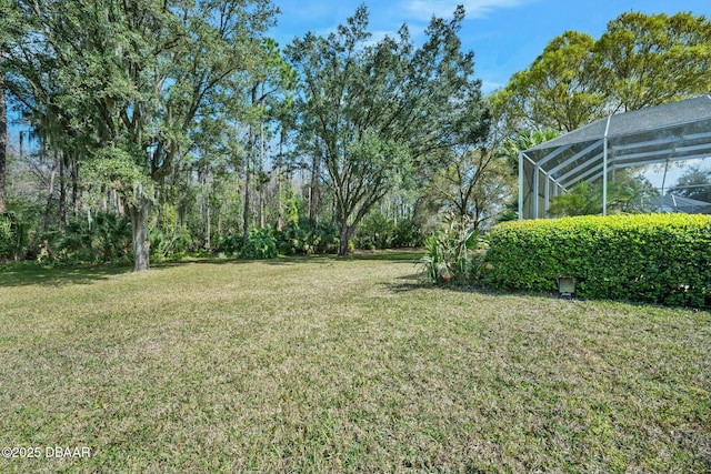 view of yard featuring a lanai