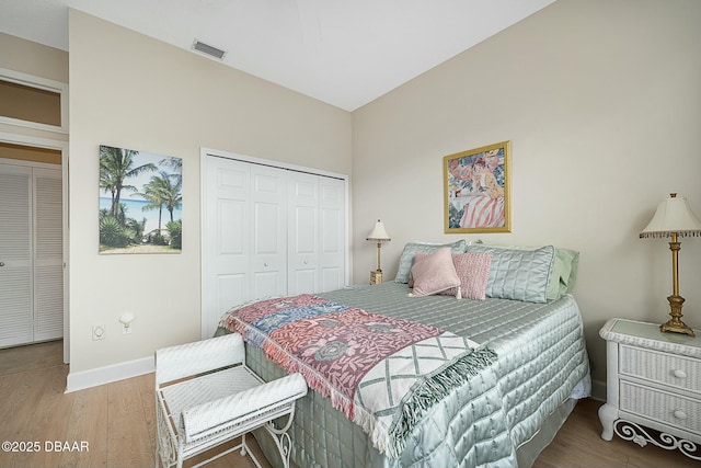 bedroom featuring hardwood / wood-style flooring and a closet