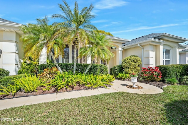 32 Gale Ln, Ormond Beach, FL 32174 - view of home's exterior with stucco siding and a lawn