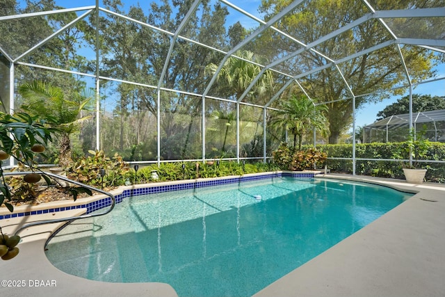 view of pool featuring glass enclosure