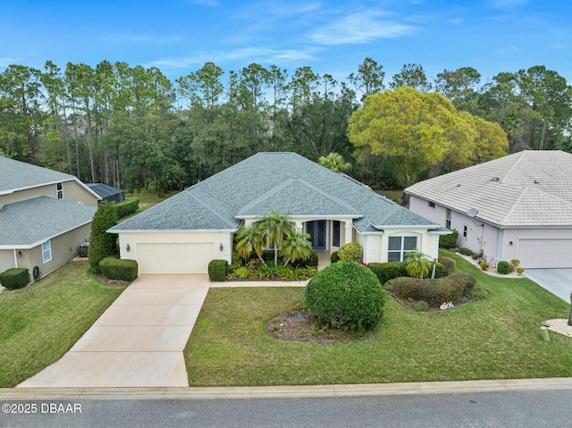 view of front of home with a garage and a front lawn