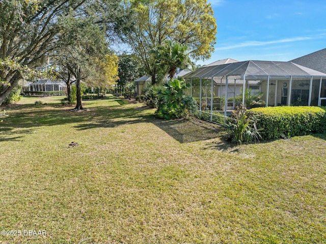 view of yard with a lanai