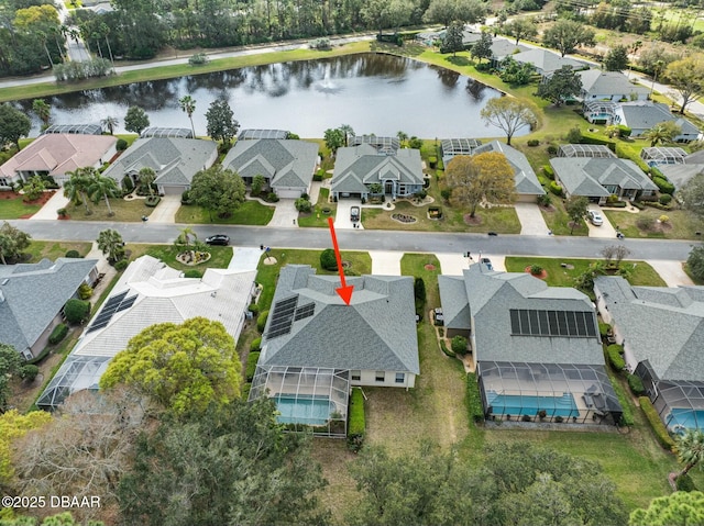 drone / aerial view with a water view