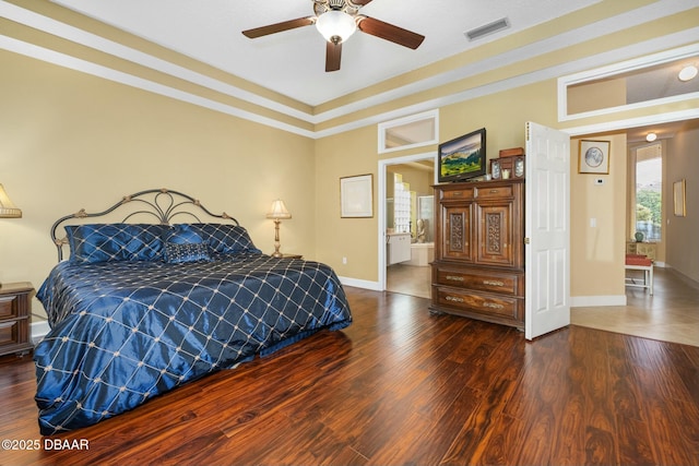 bedroom with dark hardwood / wood-style floors and ceiling fan