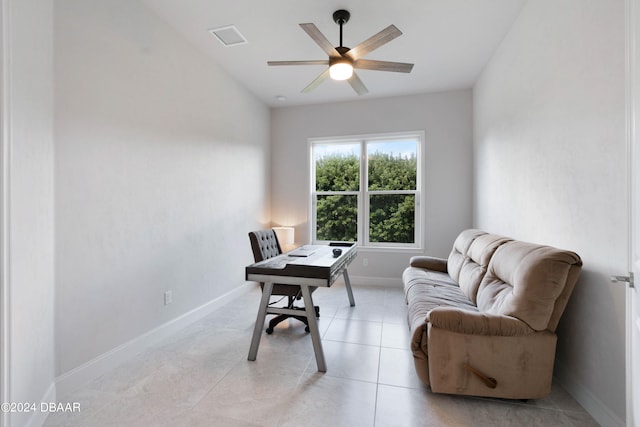 tiled office featuring ceiling fan