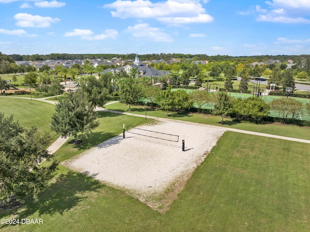 view of community featuring a lawn and volleyball court