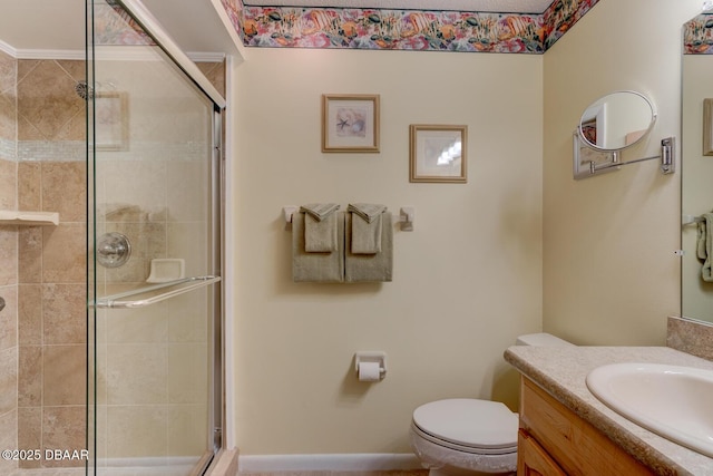 full bath featuring a stall shower, vanity, and toilet