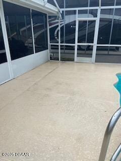 view of patio / terrace with glass enclosure and a swimming pool