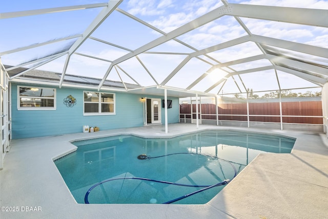 view of pool with a patio area and a lanai