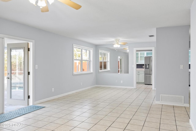 unfurnished room with light tile patterned floors