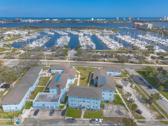 birds eye view of property with a water view