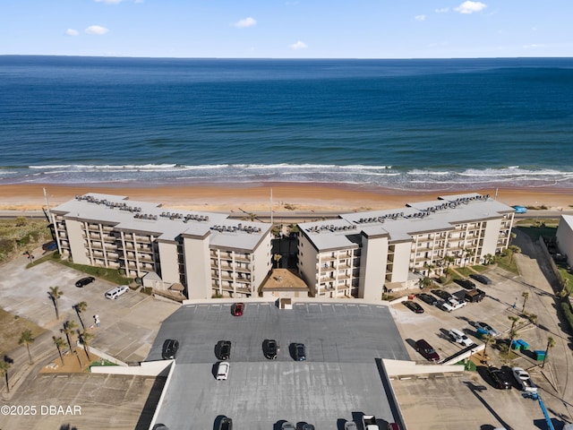 bird's eye view with a water view and a view of the beach