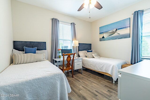 bedroom featuring hardwood / wood-style floors and ceiling fan