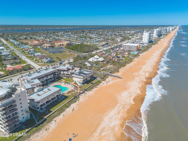 aerial view with a beach view and a water view