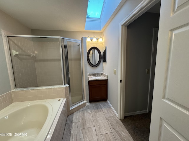 bathroom with vanity and independent shower and bath