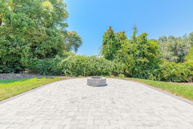 view of patio / terrace featuring a fire pit