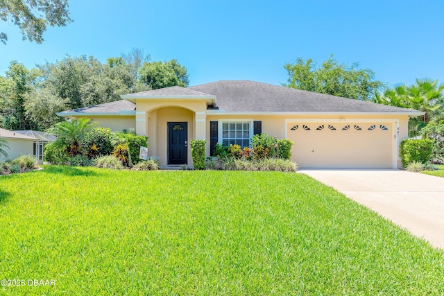 view of front of home featuring a garage and a front yard